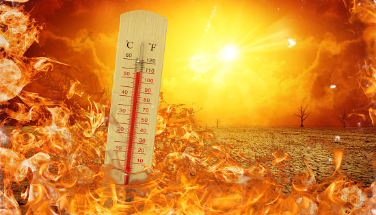 A thermometer reads extreme temperatures amidst a fiery landscape with barren trees under a blazing sun, depicting intense heat.