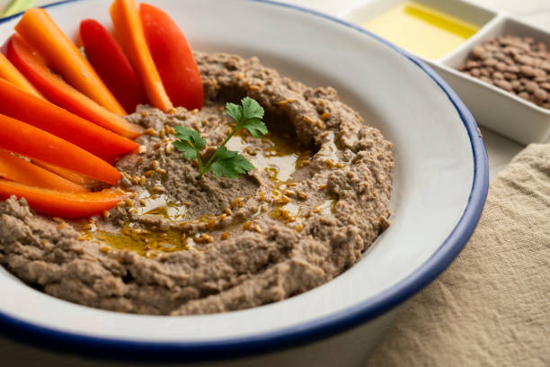istock Lentil hummus served with carrot and red pepper. 2007490283
