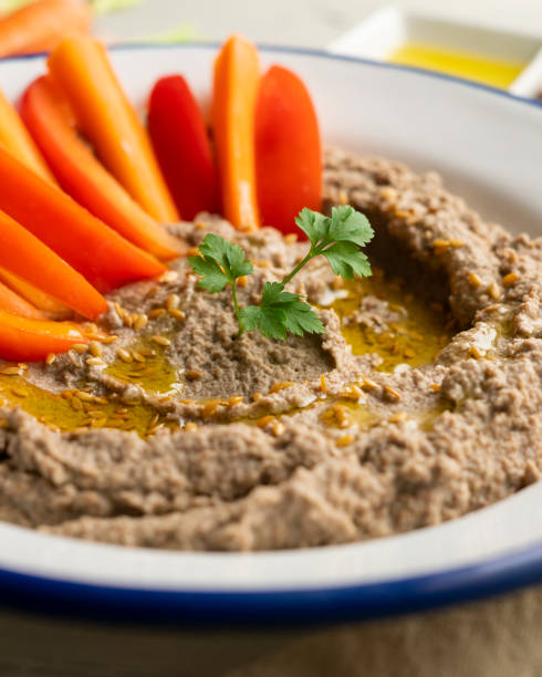 istock Lentil hummus served with carrot and red pepper. 2007490436