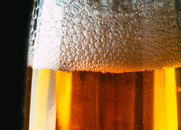 istock Bubbles in a bottle of lager beer macro close up 2007511735