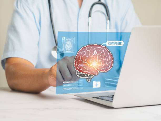 istock A doctor reads a brain examination report on a virtual screen while sitting at a desk. 2007521566