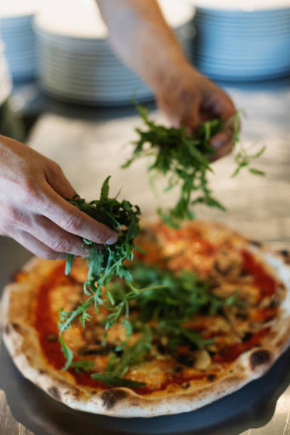 istock Chef in italian restaurant prepares vegetarian pizza 2007521585