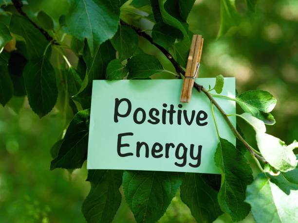 istock A green paper note with words Positive Energy hanging on a tree branch. 2007525835