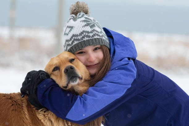 istock Happy young girl hugging her dog. 2007536403