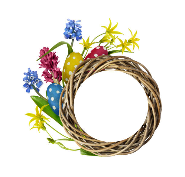 A rustic, woven wreath is mounted on a cheerful green and red wooden wall, adding charm to an outdoor area illuminated by natural sunlight.