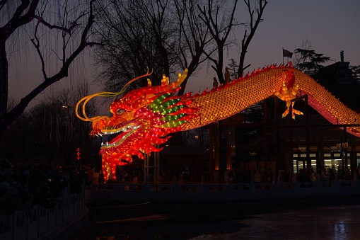 Chinese new year is most important holiday season China. Street are decorated with lanterns and current zodiac figures like 2024 is year of Dragon.