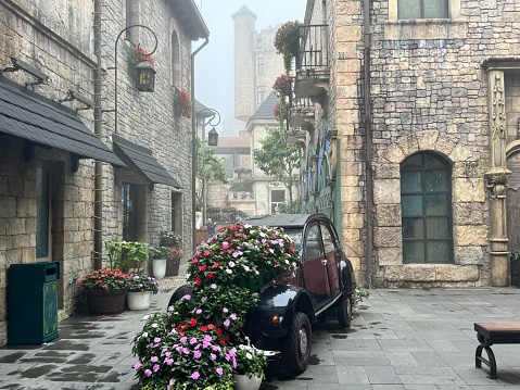 a European alley with flowers everywhere