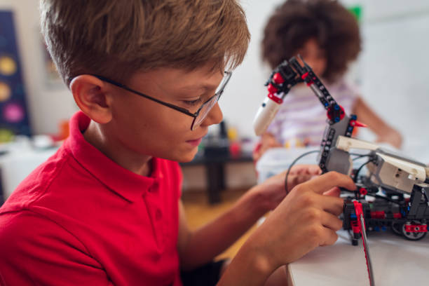 istock Children students building robotic cars at STEM classv 2007589055