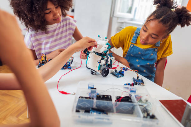 istock Children students building robotic cars at STEM classv 2007590113