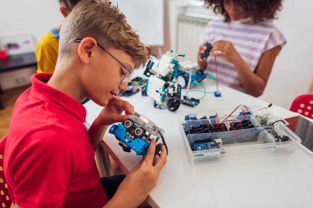 istock Children students building robotic cars at STEM classv 2007590118
