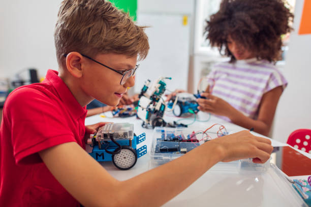 istock Children students building robotic cars at STEM classv 2007590657
