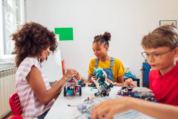 istock Children students building robotic cars at STEM classv 2007591176