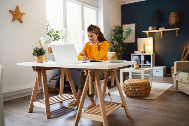 istock Dedicated young woman working from home office on the laptop 2007594651