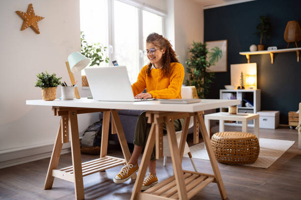 istock While working from the home office, young woman online shopping 2007594940