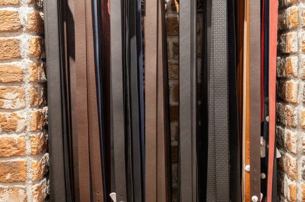 istock Close-up view of bricks and leather belts in shop window. 2007595976