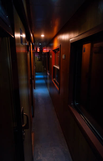 istock Empty vintage corridor of railway sleeping car at dusk. 2007596541