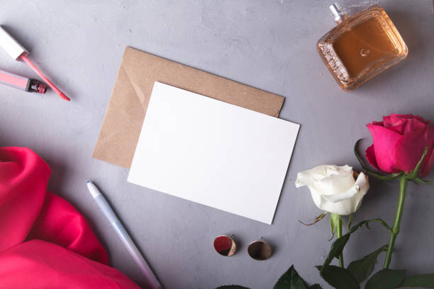 istock Romantic writing set with fresh roses and elegant perfume on a textured background 2007608306
