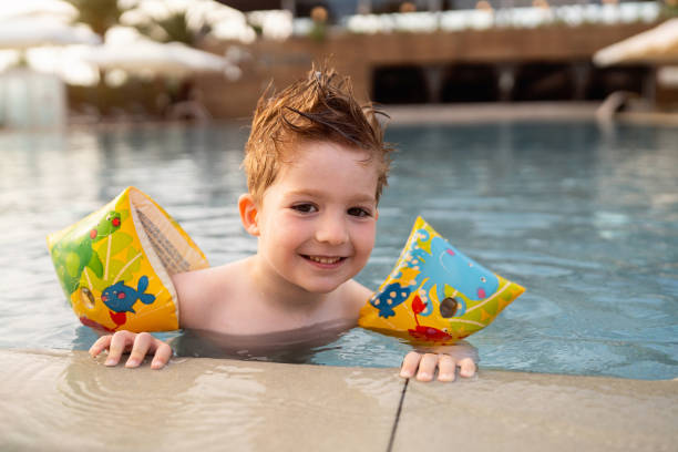 istock Little boy enjoying a day at the swimming pool 2007628352