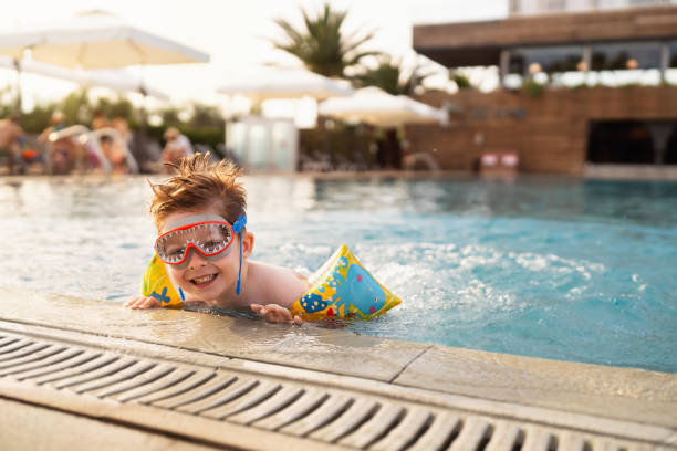 Little boy enjoying a day at the swimming pool