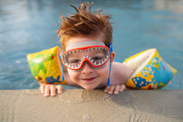 istock Little boy enjoying a day at the swimming pool 2007629967