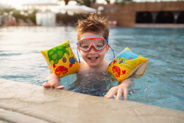 istock Little boy enjoying a day at the swimming pool 2007630489