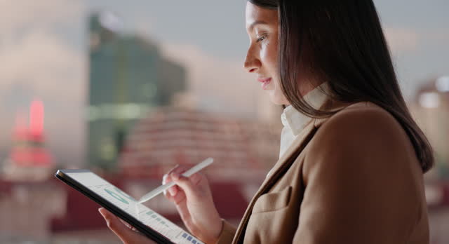 Tablet, pen and business woman in city for research, reading and statistics at sunset. Serious, tech and professional with stylus outdoor, data or financial analyst with information for remote work