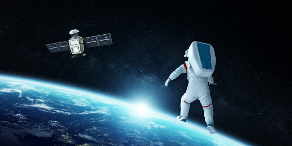 An astronaut floats in the vastness of space near Earth, with a satellite orbiting in the background, symbolizing human exploration.