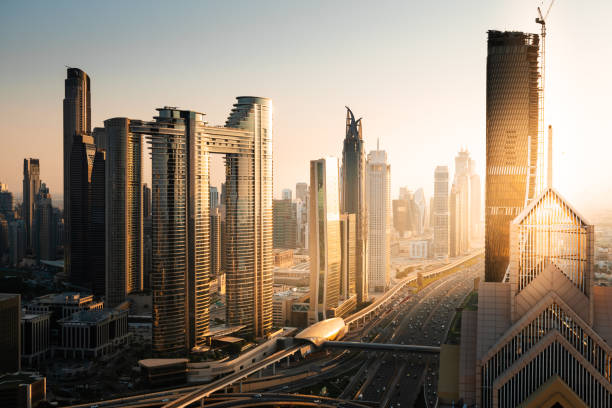 Dubai downtown skyline with modern skyscrapers at sunset. United Arab Emirates.