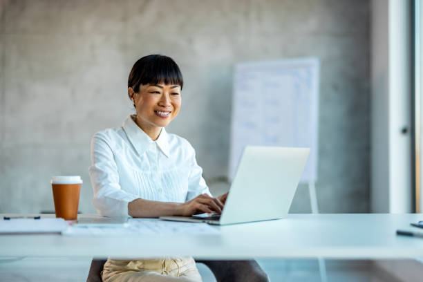 istock Communication, text conversation and businesswoman using laptop for web search 2007693872