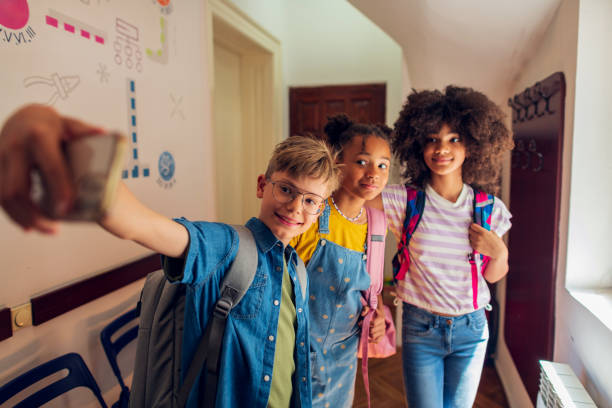 istock A group of elementary school students at the school lobby taking a selfie 2007701189