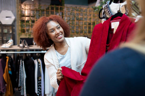 istock Smiling young woman second hand clothes shopping with a friend 2007756301
