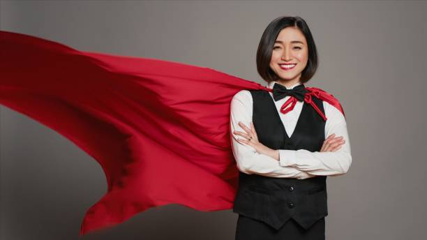 istock Hotel administrator wearing a red hero cloak on camera 2007811073