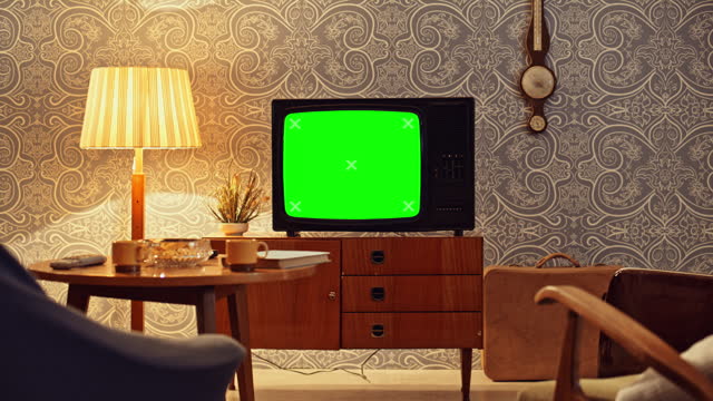 DS An old TV set in the living room with a green screen