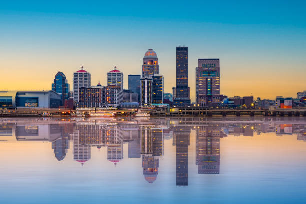 Louisville Kentucky Skyline Beautiful sunset night view of Louisville Kentucky Skyline with river and lit buildings louisville kentucky stock pictures, royalty-free photos & images
