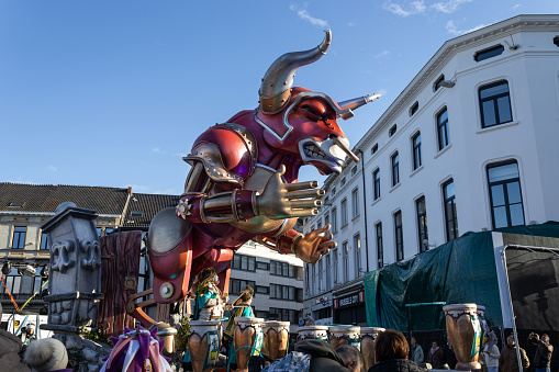 Aalst,  Belgium, 12 February 2024: Giant bull figure on a float at Aalst Carnival (from Eirg). Aalst Mardi Gras is the biggest carnival celebration in Flanders with over 100,000  spectators each year.