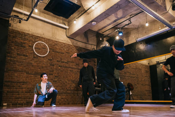 istock Japanese woman doing breakdance performance for her friends 2007849079