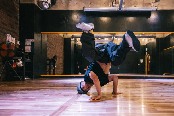 istock Japanese man showing hip hop dance moves in a dance studio 2007849604