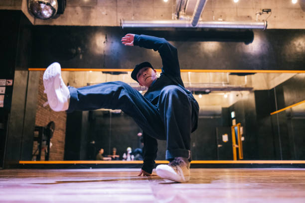 Young Japanese woman doing a hip hop pose for the camera