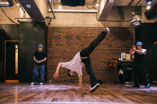 istock A breakdancer impresses friends with their moves in the dance studio 2007849640