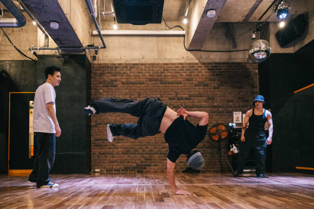 istock A breakdancer impresses friends with their moves in the dance studio 2007849658