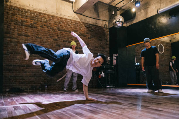 istock Hip Hop dancer doing a handstand while performing for friends 2007850189