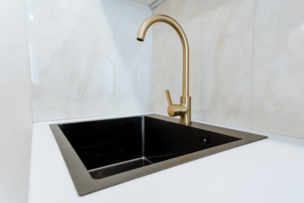 istock Single-Handle Kitchen Sink Faucet with Black Composite Sink Isolated on White Background 2007851302