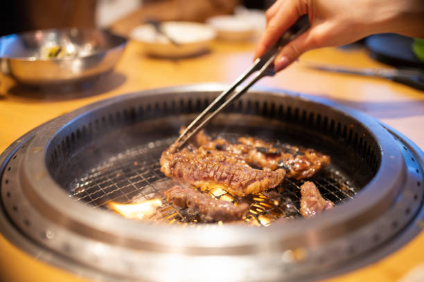istock Woman's hands grilling Yakiniku 2007851320