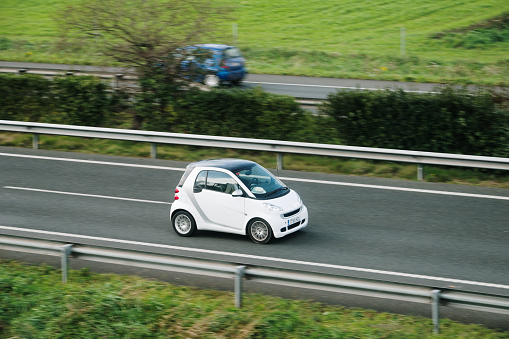 Santander, Spain - 12 February 2024: A Smart Fortwo in motion on a highway