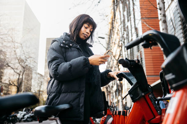 istock Woman taking a public bike. 2007864782