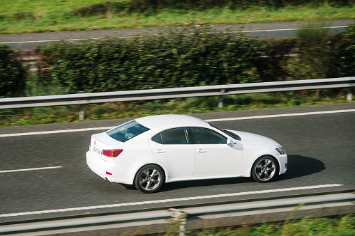 Zagreb, Croatia - August 2, 2012: Futuristically styled Citroen DS5 driving fast in the corner on the mountain road.