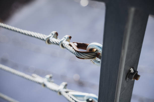 istock Close up of a metal cable railing system with a crimped loop fitting attached to a metal post. 2007866864