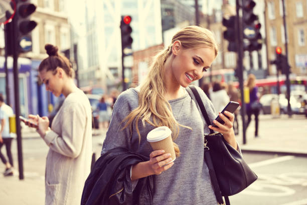 istock Young woman in the city using phone 2007876431