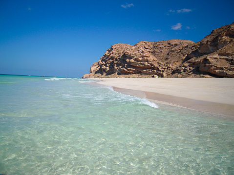 Transparent clear sea washing the white sand beach, Socotra, Yemen