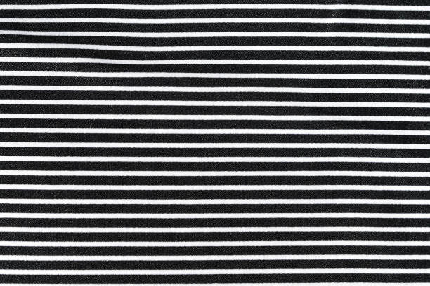 istock close-up texture of black and white striped silk fabric at an angle. Tailoring concept. Image for your design 2007911136
